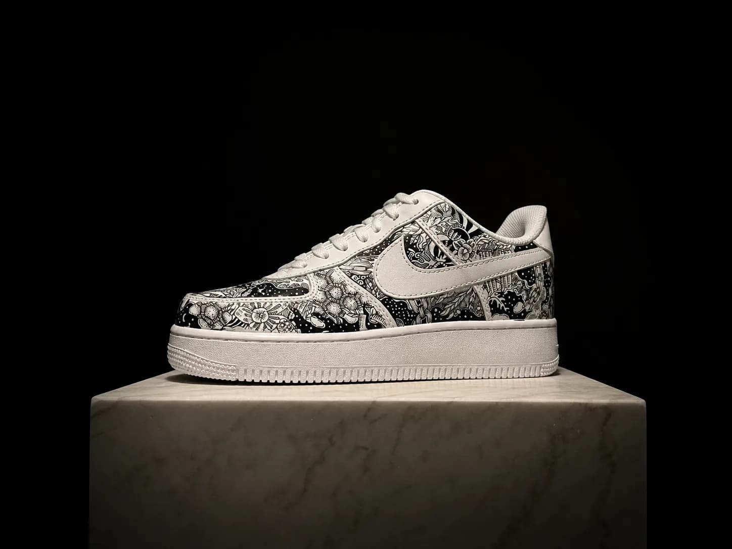 A finished hand-painted pair under museum spotlight on a marble plinth