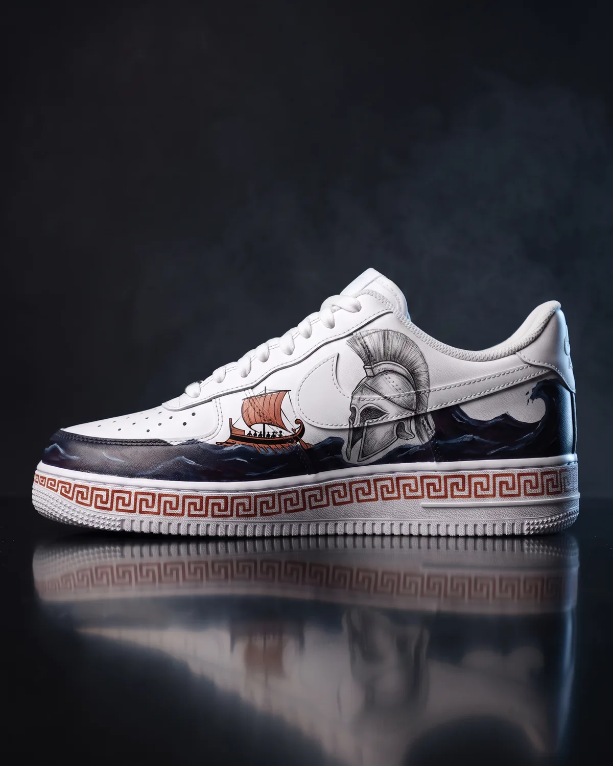 A white Air Force 1 painted with a deep indigo sea, a small oared ship and a terracotta Greek key border running along the flat foxing stripe of the midsole